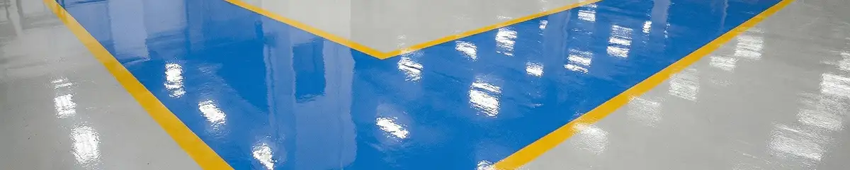 A factory floor professionally covered and marked with epoxy flooring in Anchorage, AK