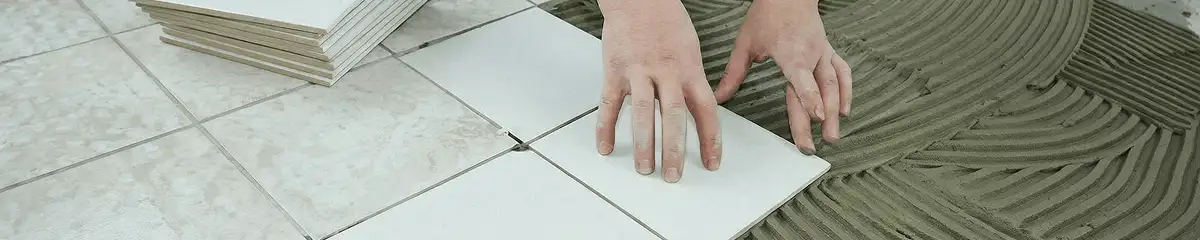 Professional installing white tile floors in Anchorage, AK