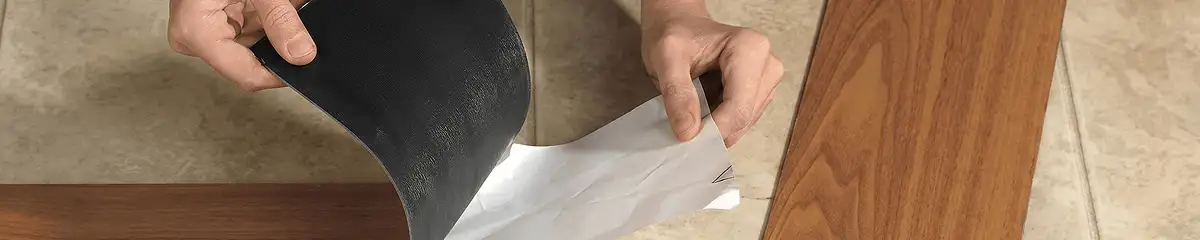 A professional installing vinyl flooring in Anchorage, AK
